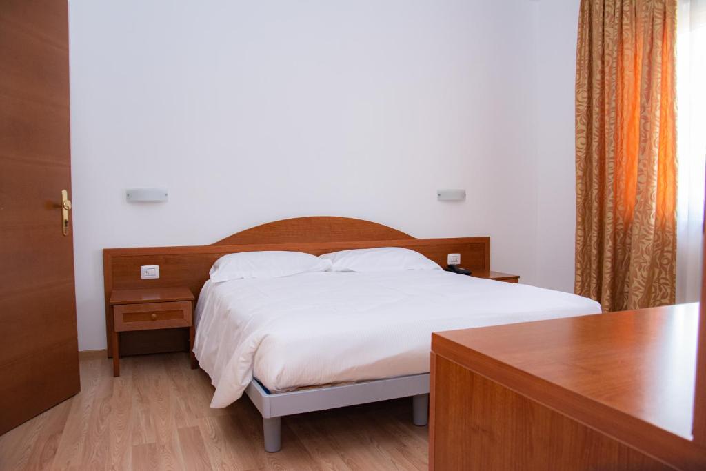 Postel nebo postele na pokoji v ubytování Hotel Nuova Barcaccia