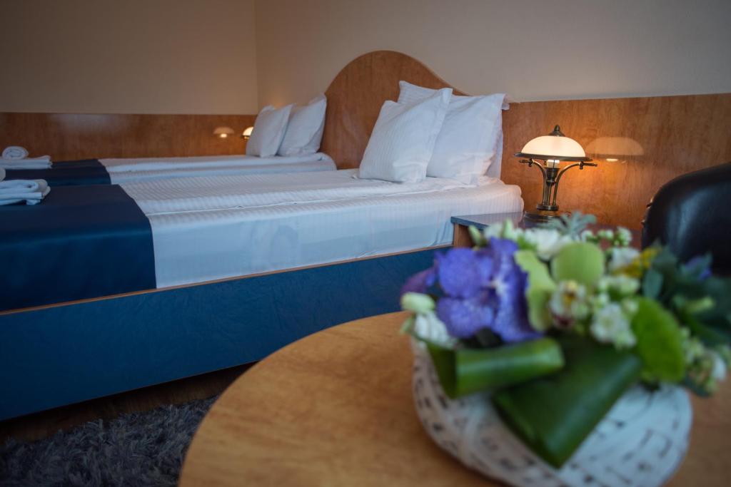 Postel nebo postele na pokoji v ubytování Hotel Marami