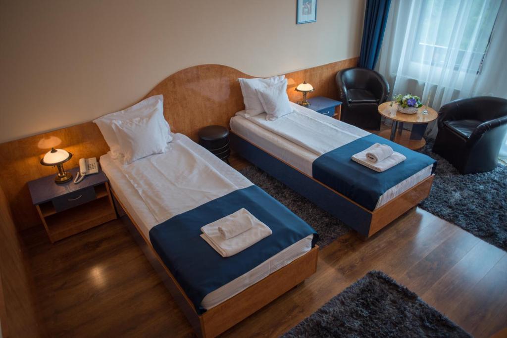 Postel nebo postele na pokoji v ubytování Hotel Marami