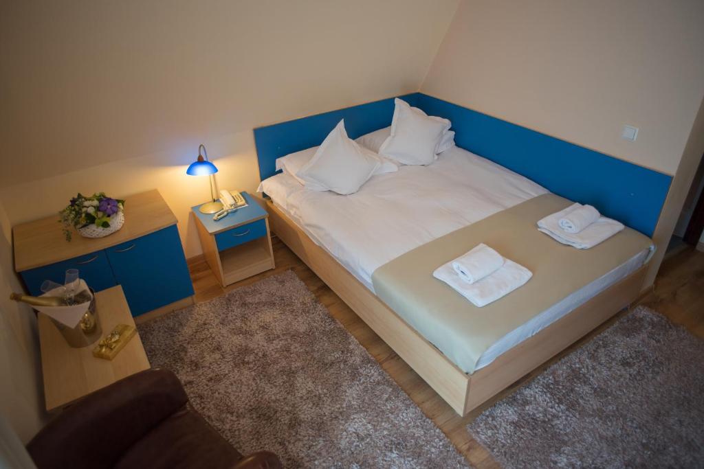 Postel nebo postele na pokoji v ubytování Hotel Marami