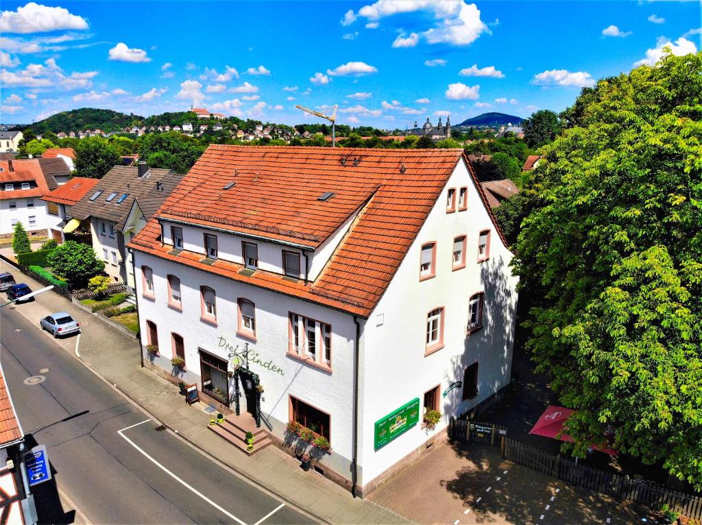 an overhead view of a white building with a red roof at Hotel Gasthof Metzgerei Drei Linden in Fulda
