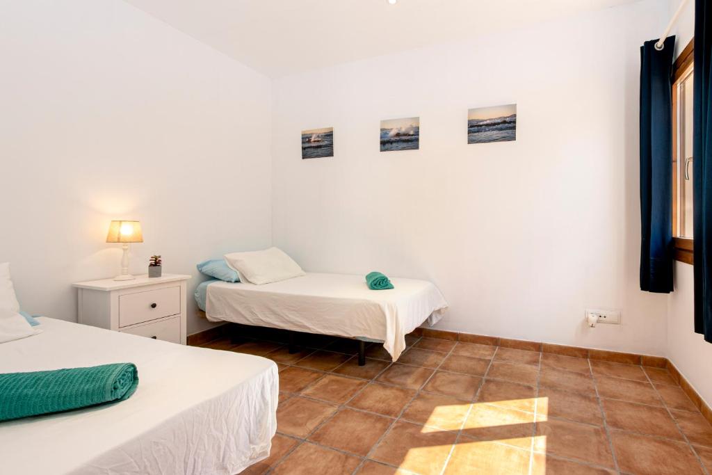 Postel nebo postele na pokoji v ubytování Finca can Jaumi By homevillas360