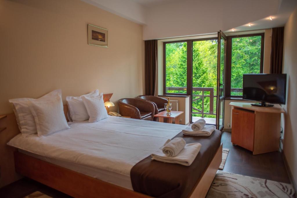 Postel nebo postele na pokoji v ubytování Hotel Marami