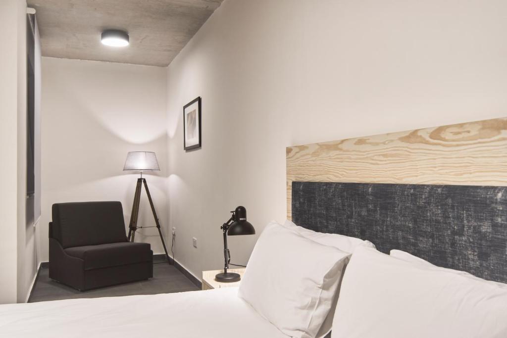 Postel nebo postele na pokoji v ubytování Mr Todd Hotel