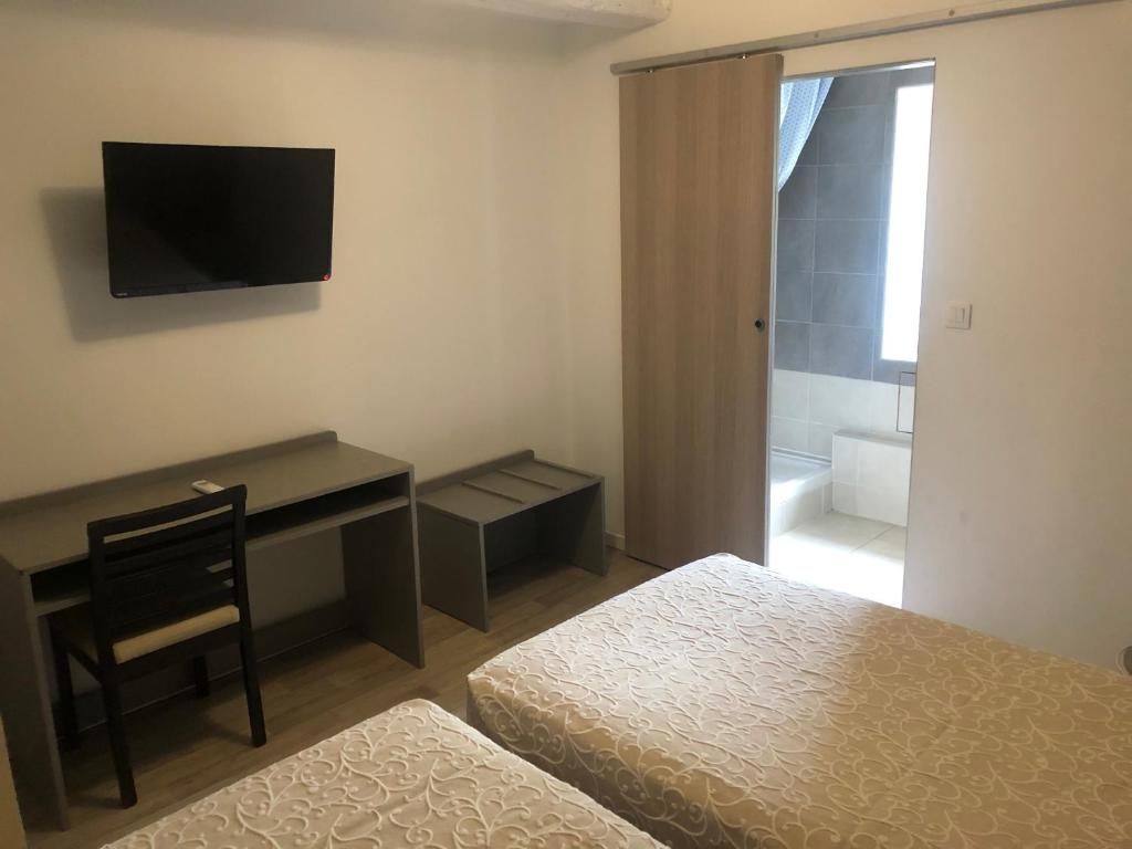 TV a/nebo společenská místnost v ubytování Hotel Aurelia