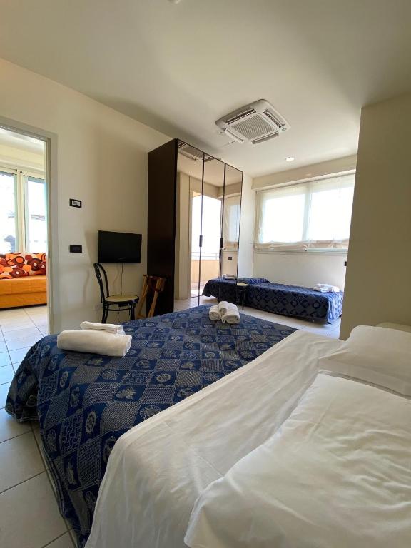 Postel nebo postele na pokoji v ubytování Hotel Avana Fronte Mare