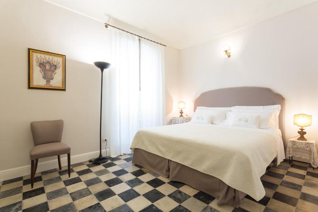 Postel nebo postele na pokoji v ubytování San Carlo Suites
