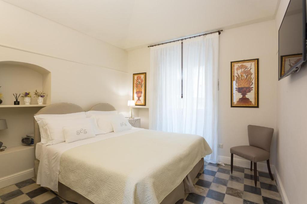 Postel nebo postele na pokoji v ubytování San Carlo Suites