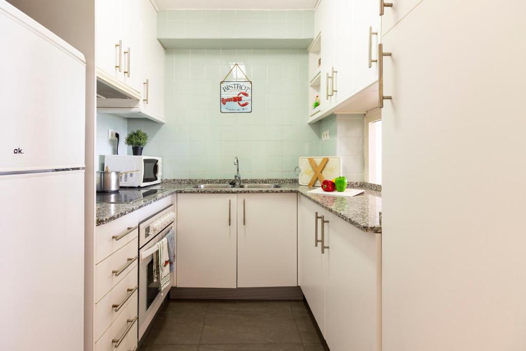 Kuchyň nebo kuchyňský kout v ubytování Homes & Go Bell Reco Confort II