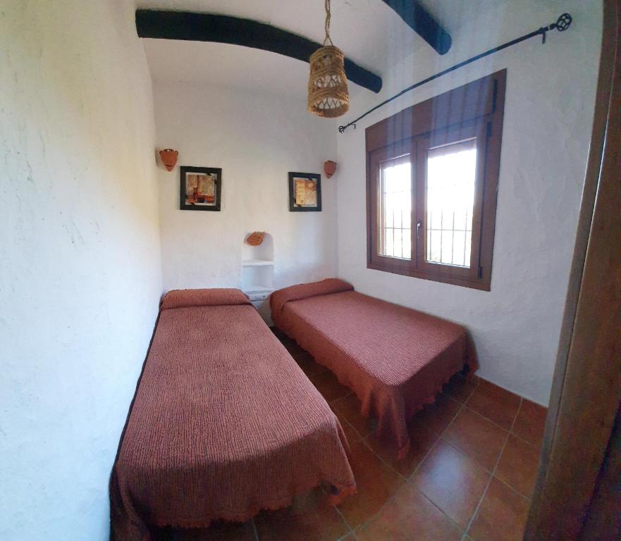 Postel nebo postele na pokoji v ubytování Casas Rurales La Minilla