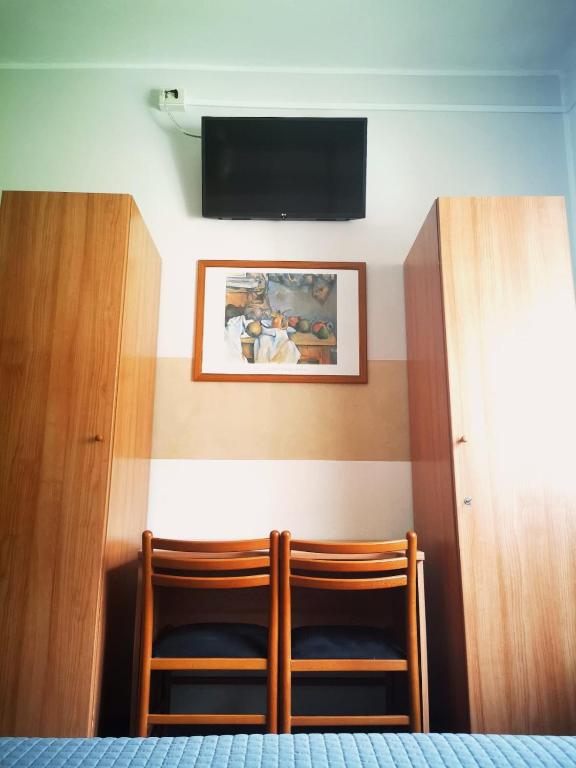 TV a/nebo společenská místnost v ubytování Albergo Al Pescatore