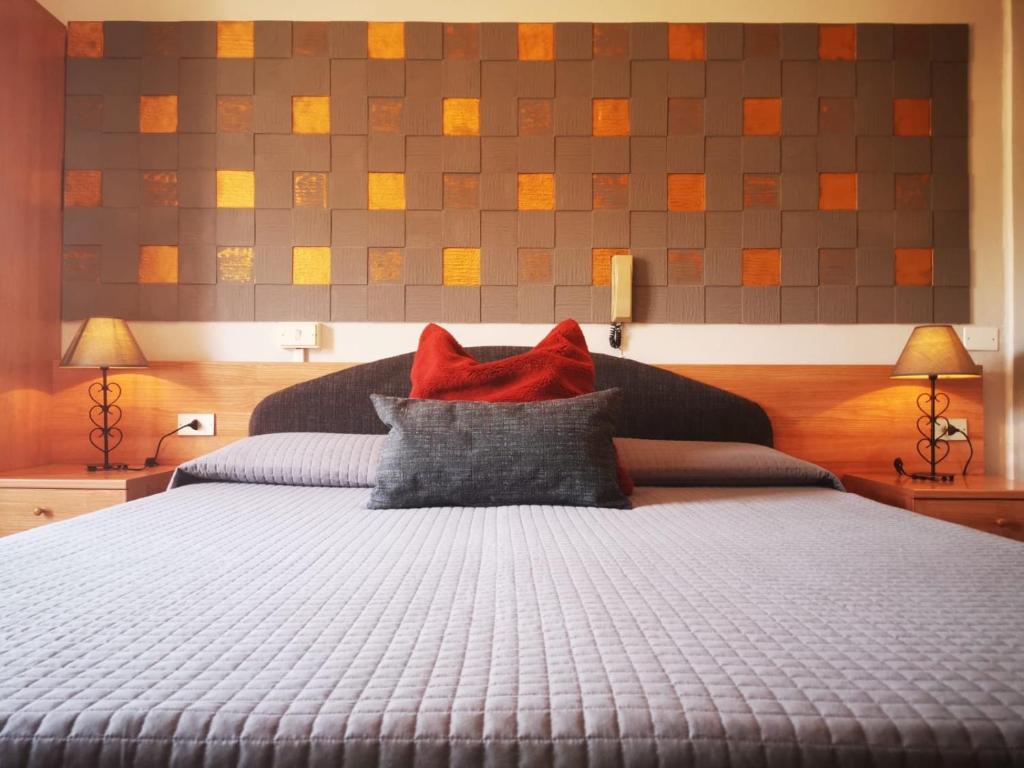 Postel nebo postele na pokoji v ubytování Albergo Al Pescatore