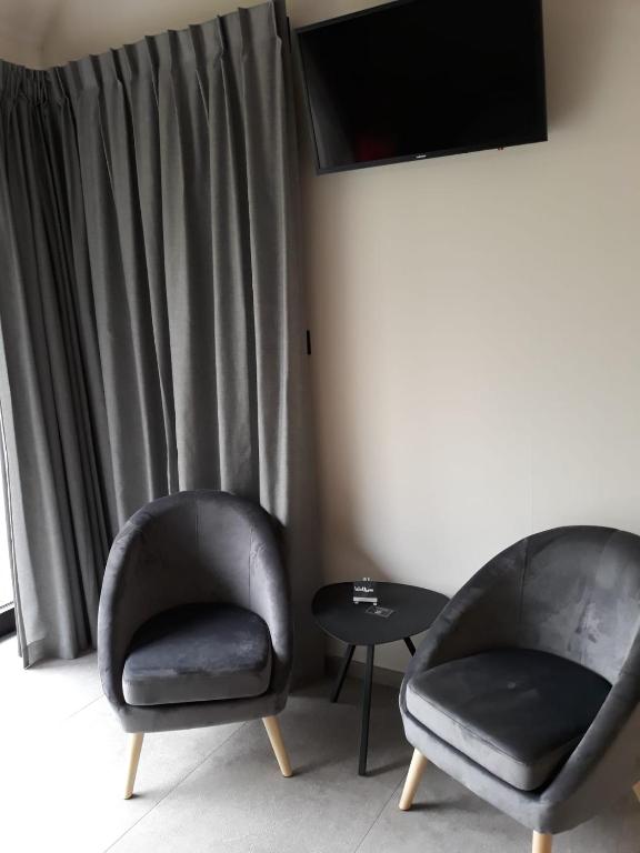 TV a/nebo společenská místnost v ubytování B&B Snelleghem