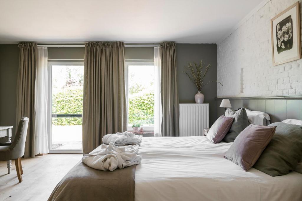 Postel nebo postele na pokoji v ubytování B&B Het Soetewater