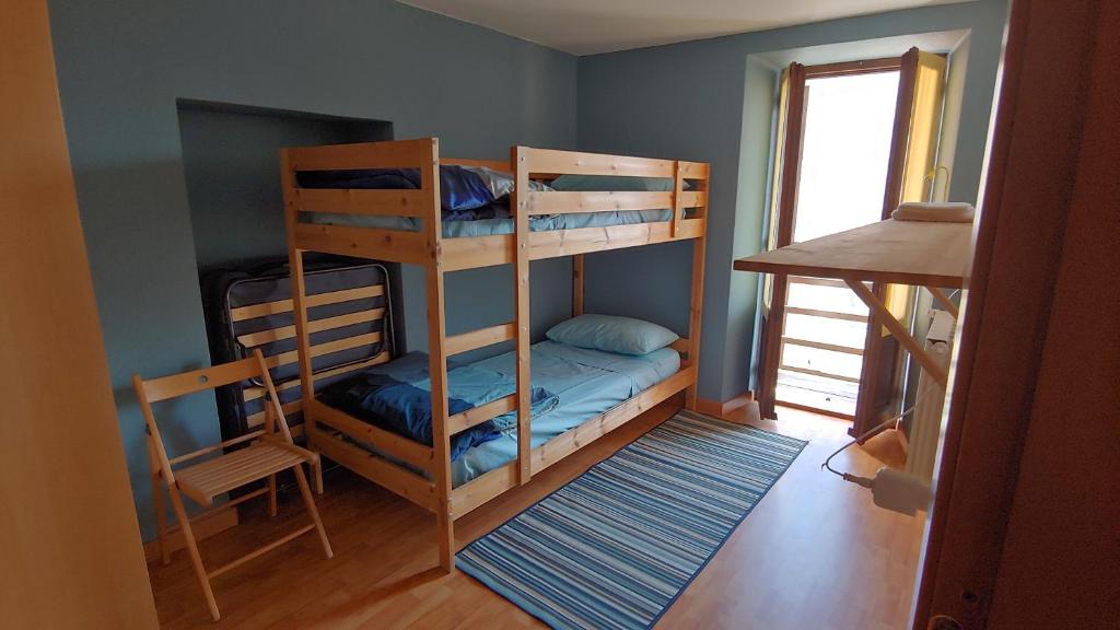 Postel nebo postele na pokoji v ubytování Ostello ValGrande