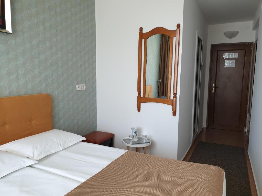 Postel nebo postele na pokoji v ubytování Hotel Ovidiu