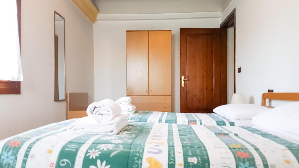 Łóżko lub łóżka w pokoju w obiekcie Alla Barchessa di Villa Querini