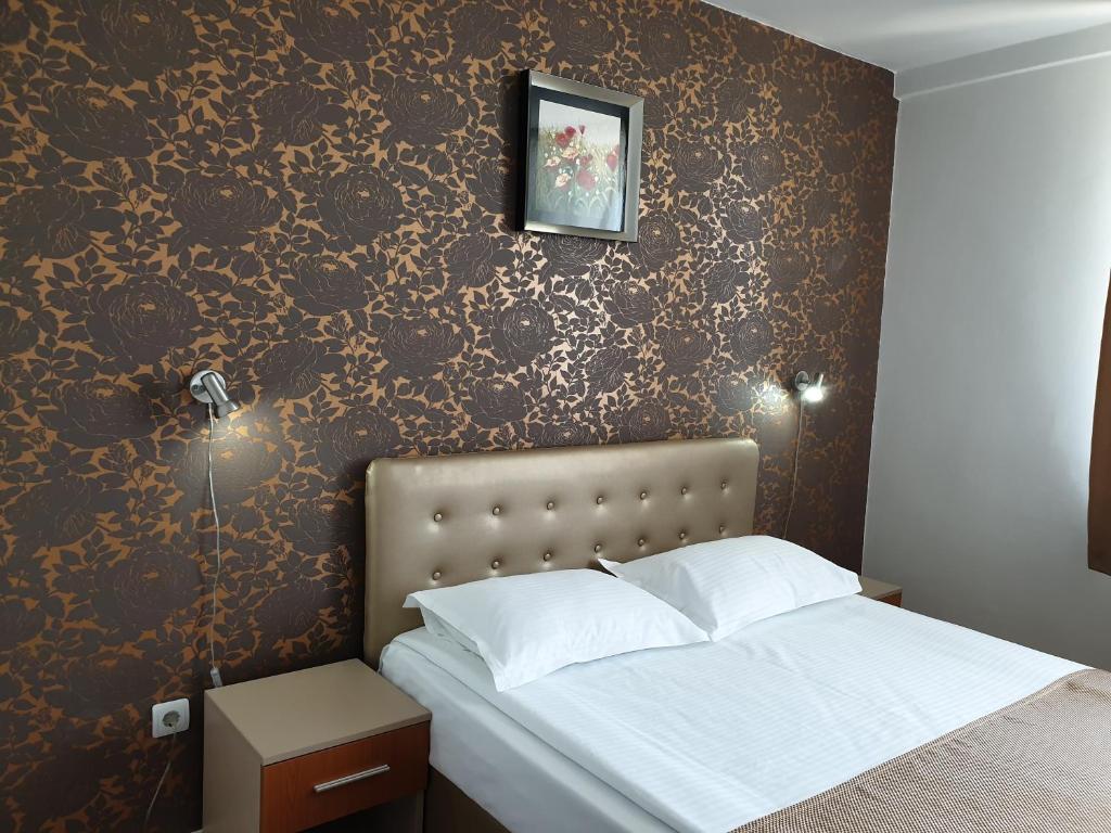 Postel nebo postele na pokoji v ubytování Hotel Ovidiu