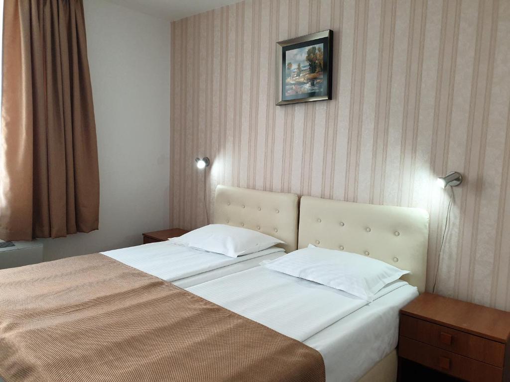 Postel nebo postele na pokoji v ubytování Hotel Ovidiu