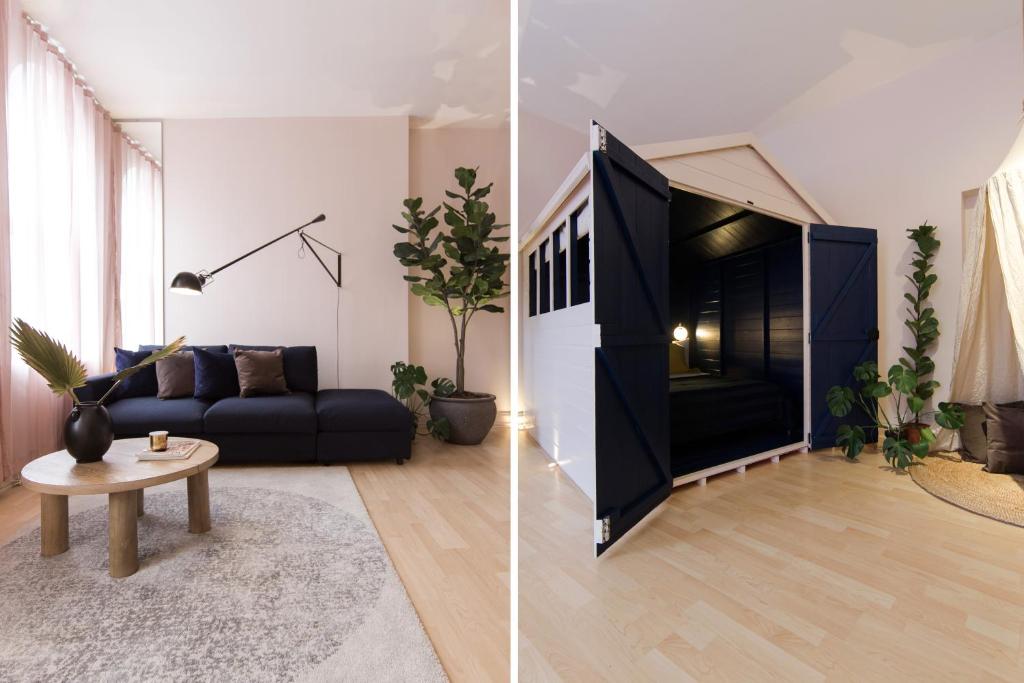 a living room with a black couch and a table at The Beach Hut in Shoreditch, by the Design Traveller in London