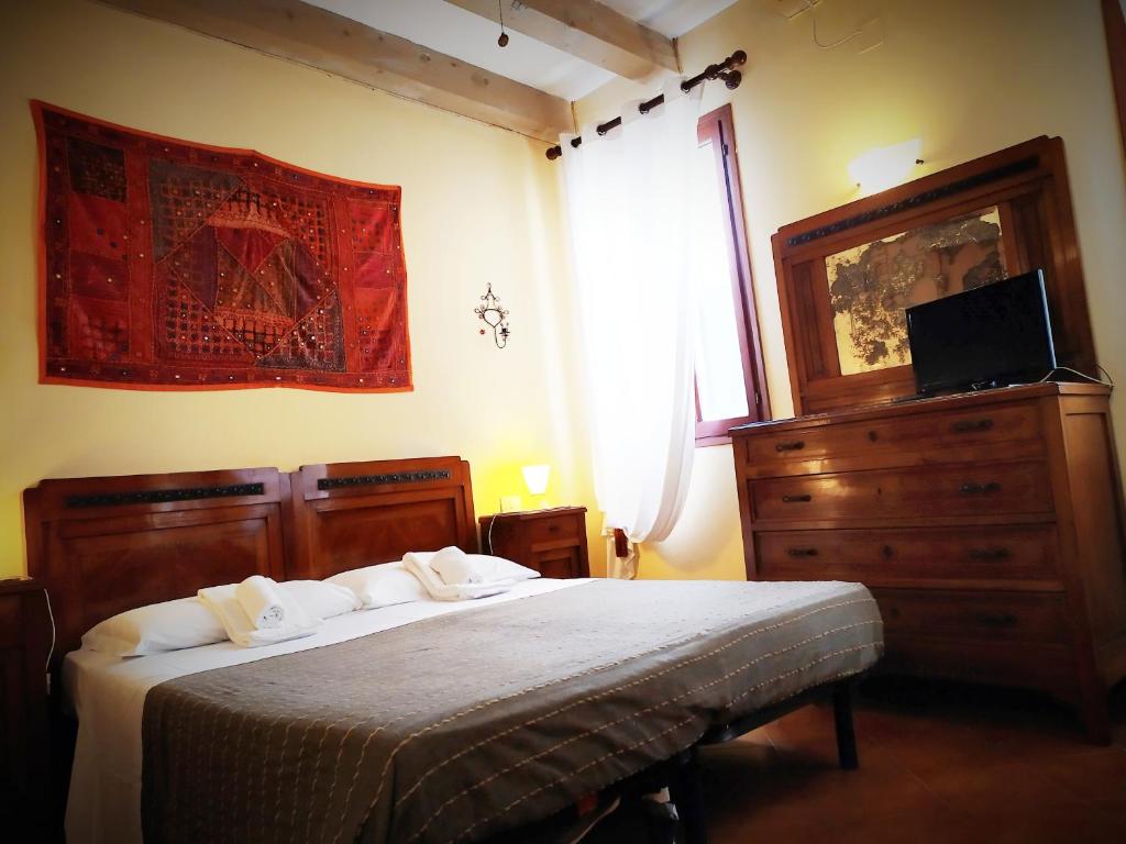 Posteľ alebo postele v izbe v ubytovaní Booking San Marco Apartment