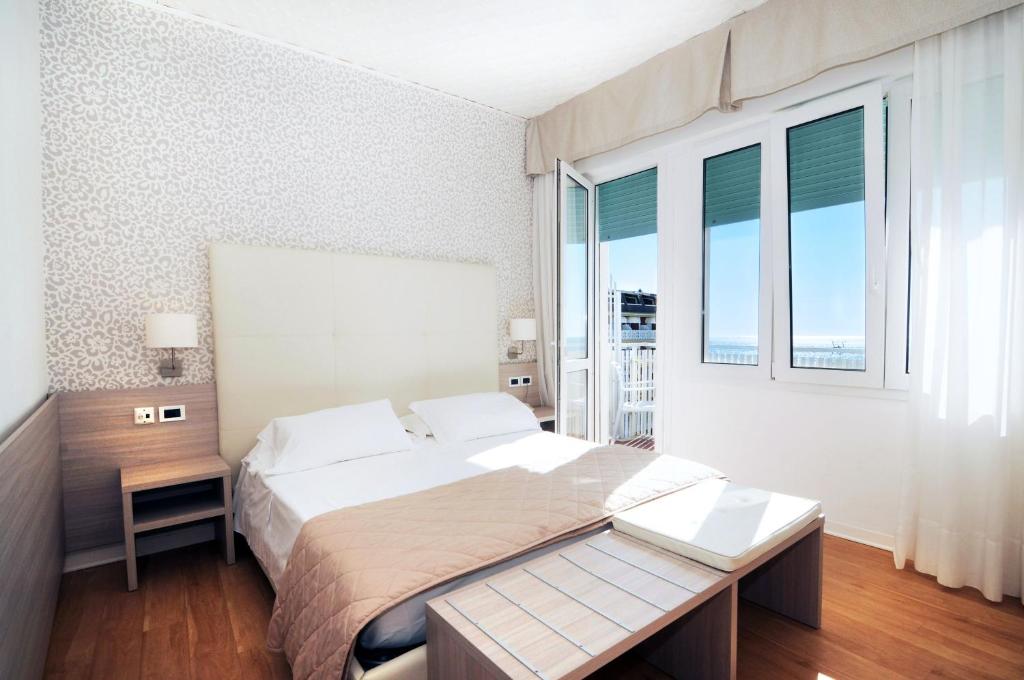 Postel nebo postele na pokoji v ubytování Hotel Splendid