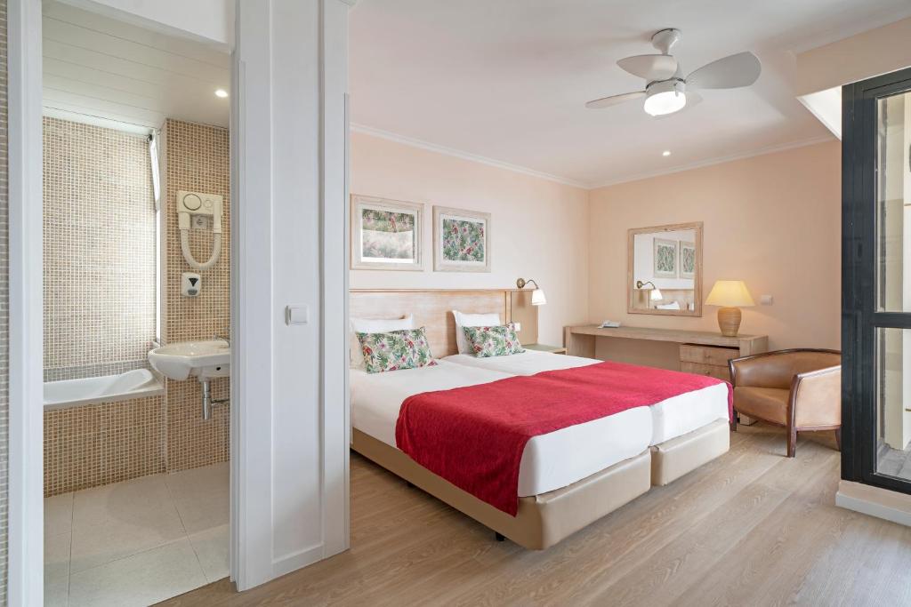 Postel nebo postele na pokoji v ubytování Buganvilia Studio Hotel