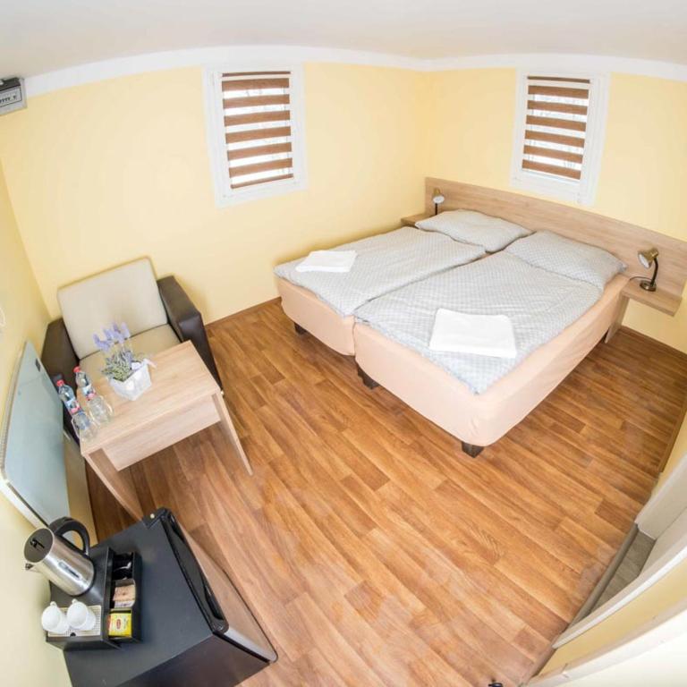 Postel nebo postele na pokoji v ubytování Obora resort