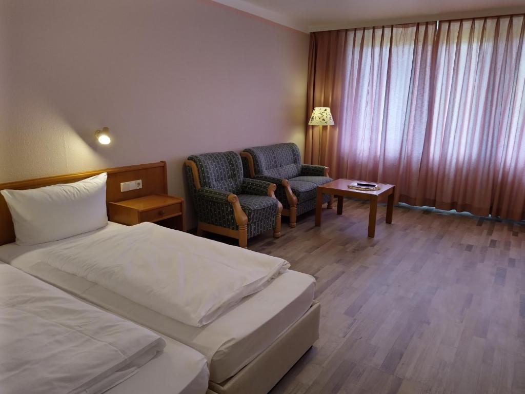 Postel nebo postele na pokoji v ubytování Hotel Faller