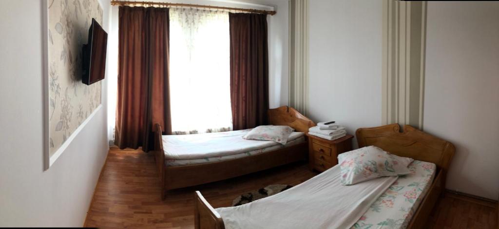 Postel nebo postele na pokoji v ubytování “Doru’ Muntelui”