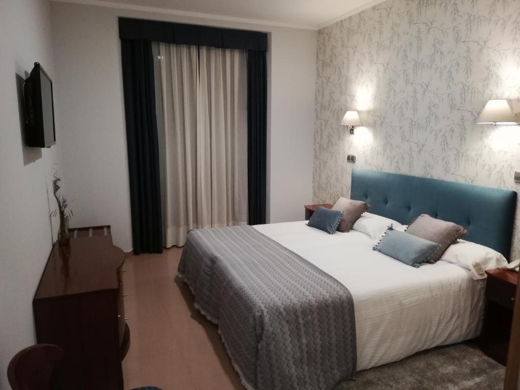 Postel nebo postele na pokoji v ubytování Hotel Las Moradas