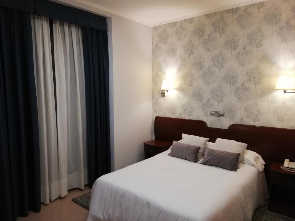 Postel nebo postele na pokoji v ubytování Hotel Las Moradas