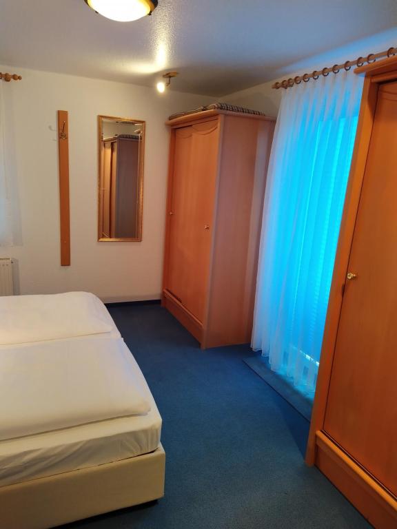Postel nebo postele na pokoji v ubytování Hotel Faller