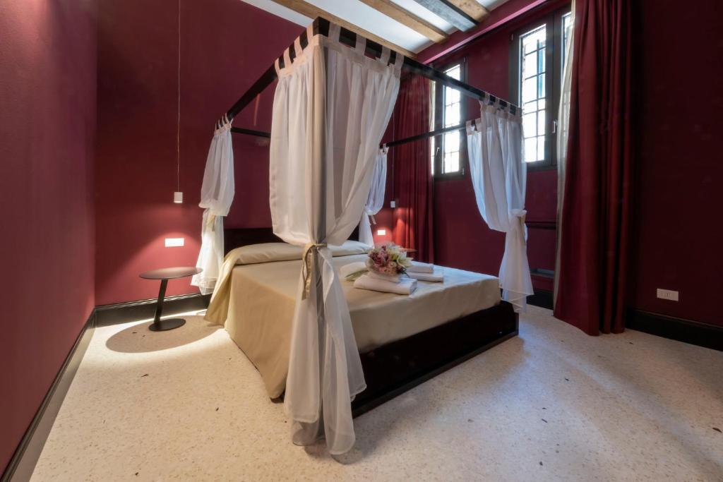 Posteľ alebo postele v izbe v ubytovaní Residence Poli Venezia
