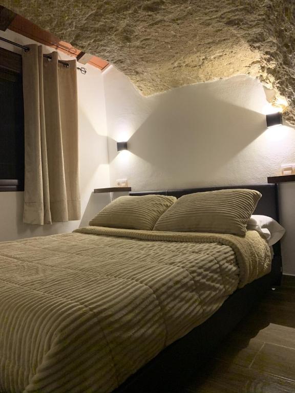 Postel nebo postele na pokoji v ubytování Apartamentos3Cuevas
