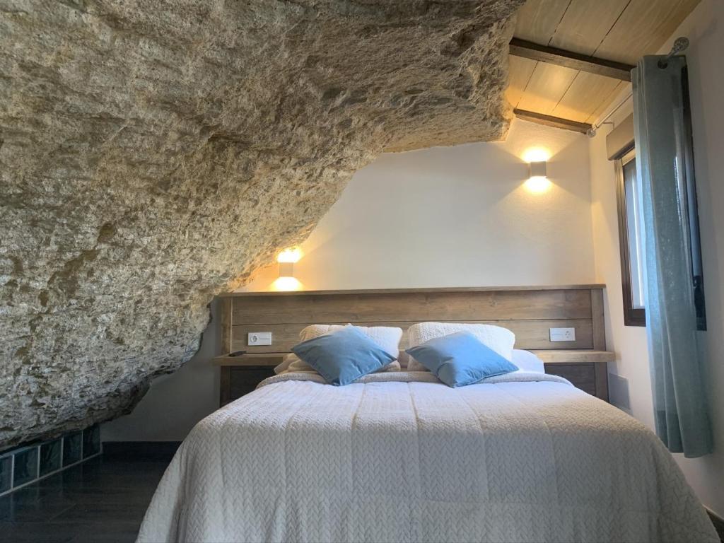 Postel nebo postele na pokoji v ubytování Apartamentos3Cuevas
