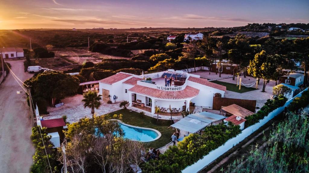 an aerial view of a house with a swimming pool at The Lighthouse Hostel in Sagres