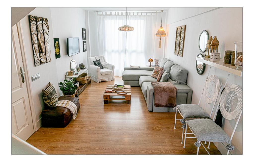 a living room with a couch and chairs at La casita de vanessa in Playa del Hombre