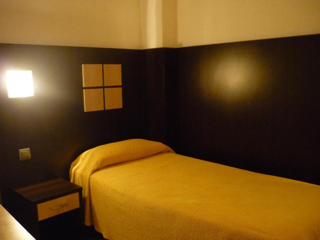 Posteľ alebo postele v izbe v ubytovaní Hotel Haromar