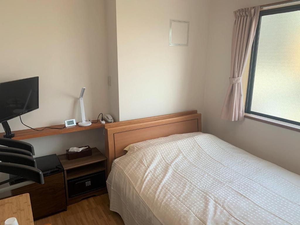 En eller flere senger på et rom på Sado - Hotel - Vacation STAY 82477