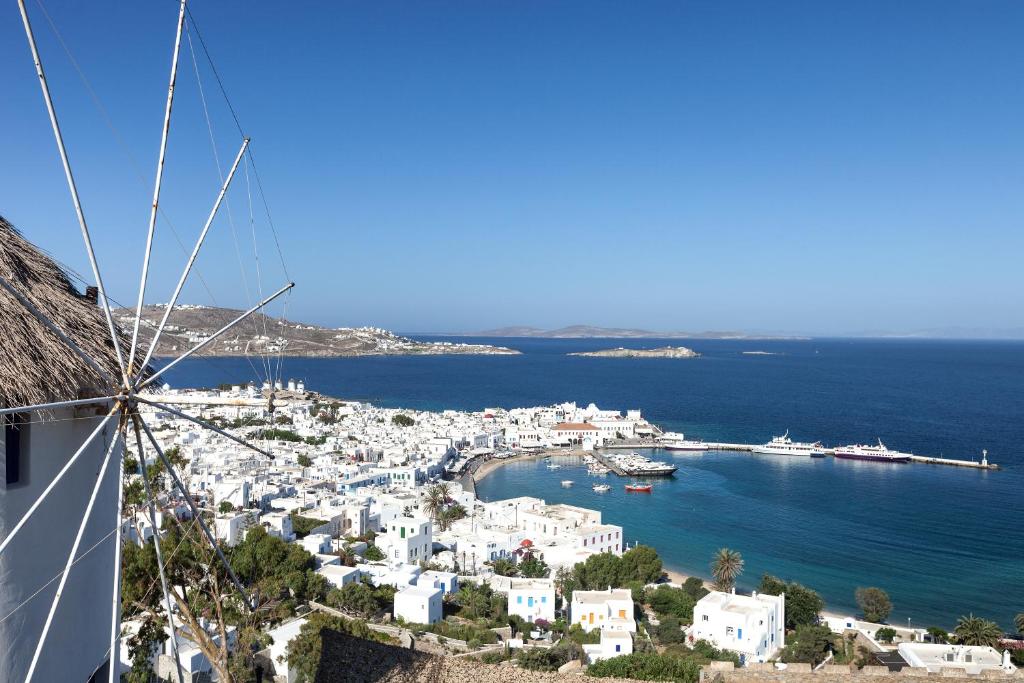 a view of a small town on the ocean at Castle Panigirakis in Mikonos