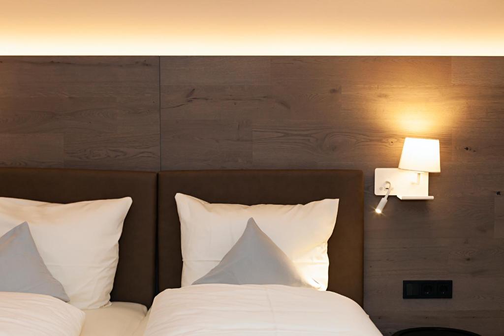 Postel nebo postele na pokoji v ubytování Hotel Knoblauch
