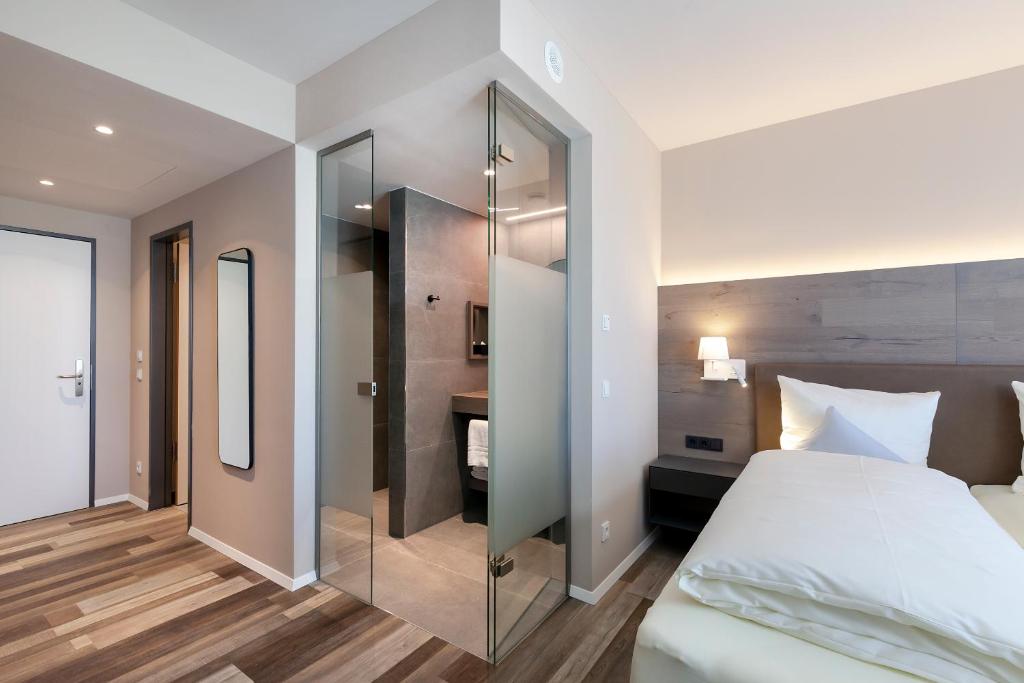 Postel nebo postele na pokoji v ubytování Hotel Knoblauch