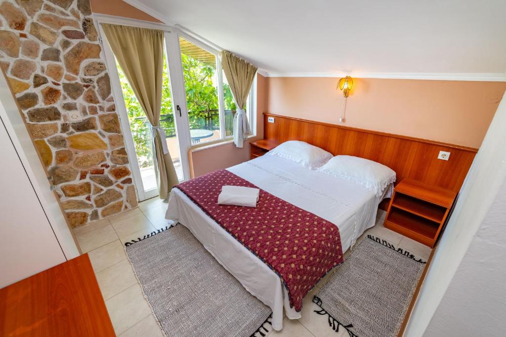 Posteľ alebo postele v izbe v ubytovaní Olive House Zadar