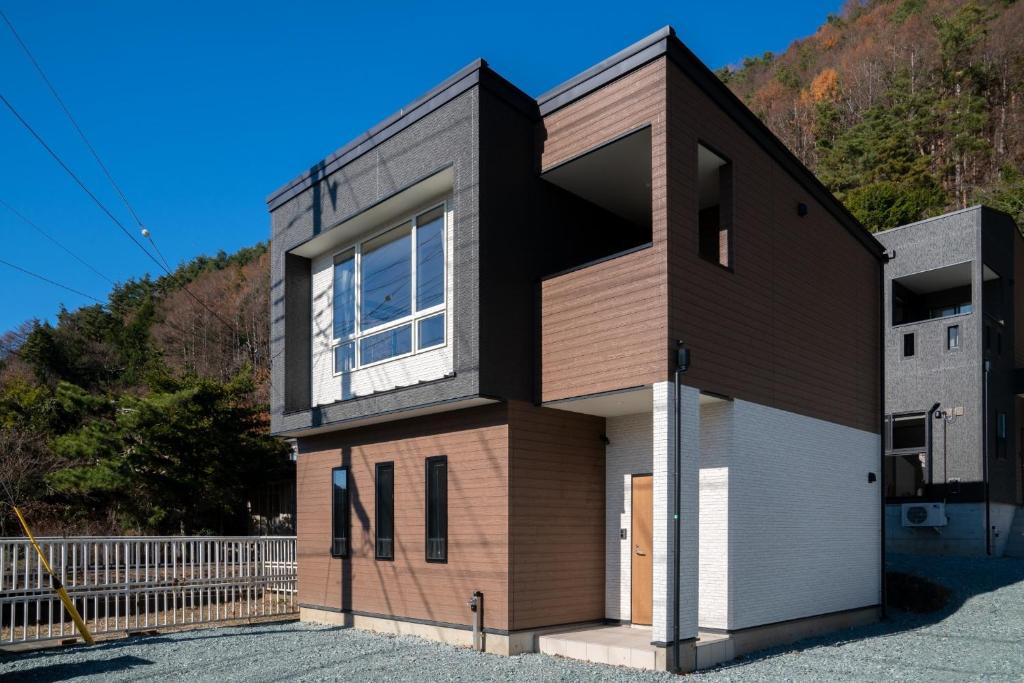 a house with a large window on the side of it at Minamitsuru-gun - House - Vacation STAY 82353 in Fujikawaguchiko