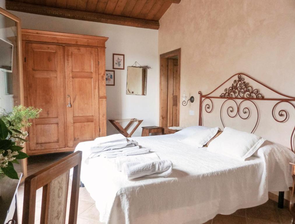 Voodi või voodid majutusasutuse Pian del Pigro toas