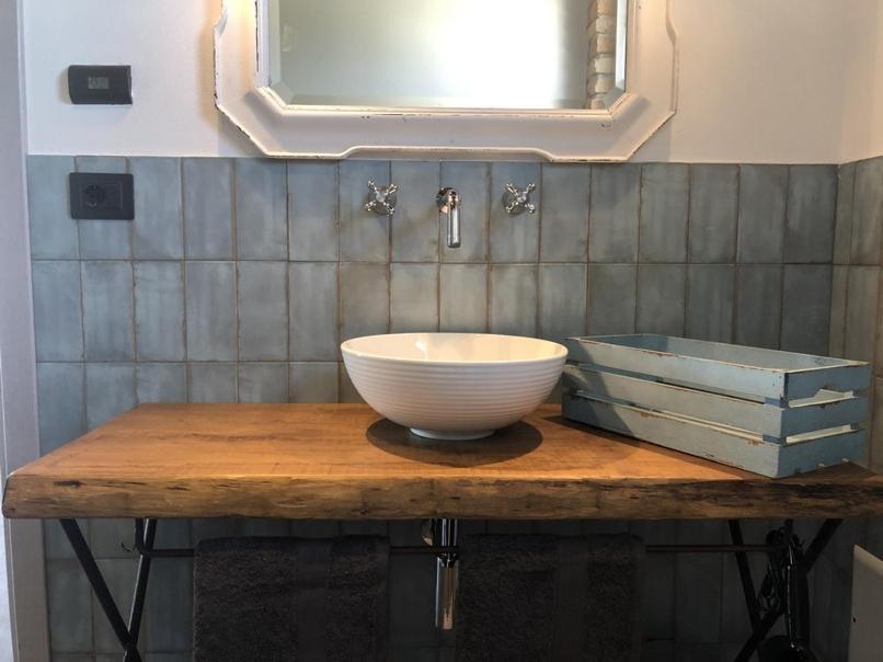 a bowl on a wooden table in a bathroom at Tenuta Le More in Calosso