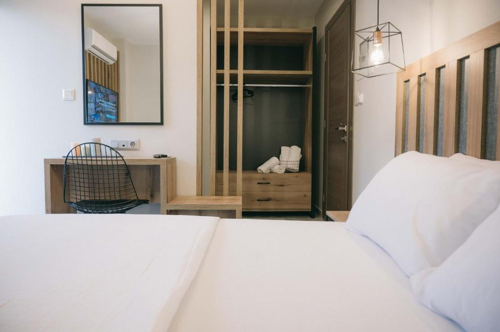Postel nebo postele na pokoji v ubytování Hotel Hermes Pieria
