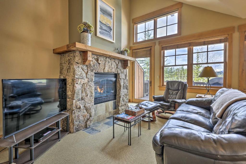 a living room with a couch and a fireplace at 3 Mi to Keystone Resort: Condo w/ Mountain View in Keystone