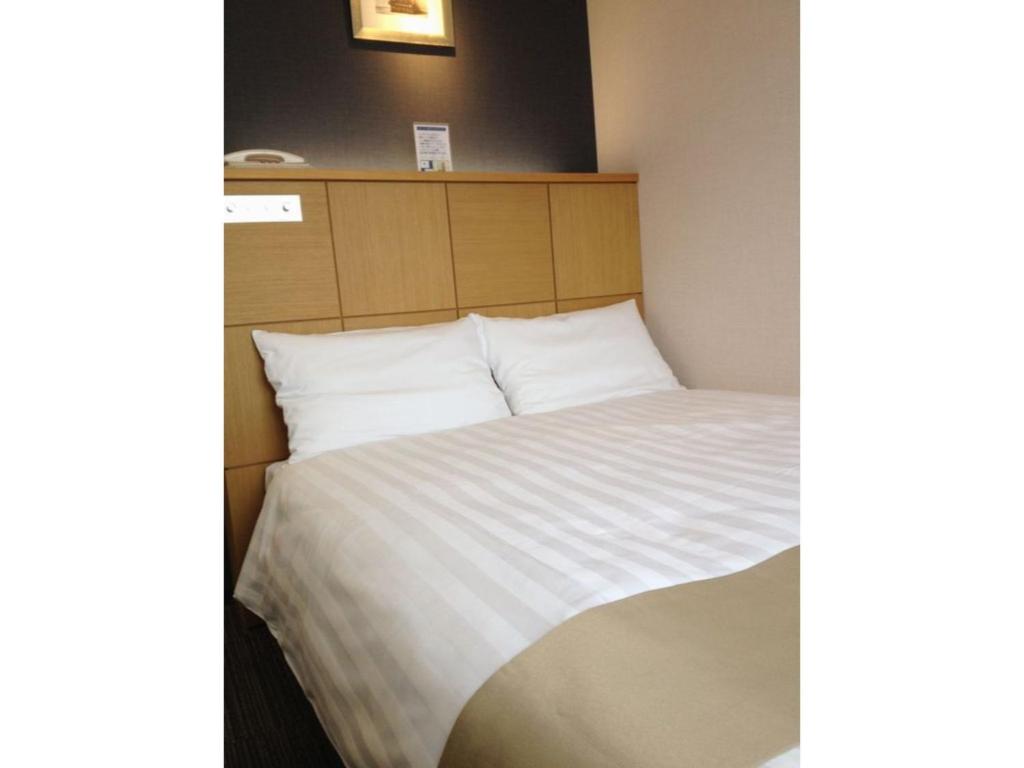 Tempat tidur dalam kamar di Hotel St Palace Kurayoshi - Vacation STAY 82277